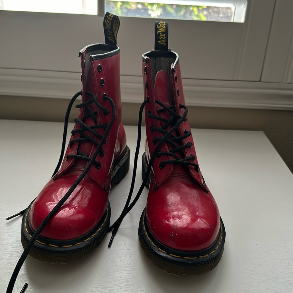 Doc Martens red leather patent combat boots.